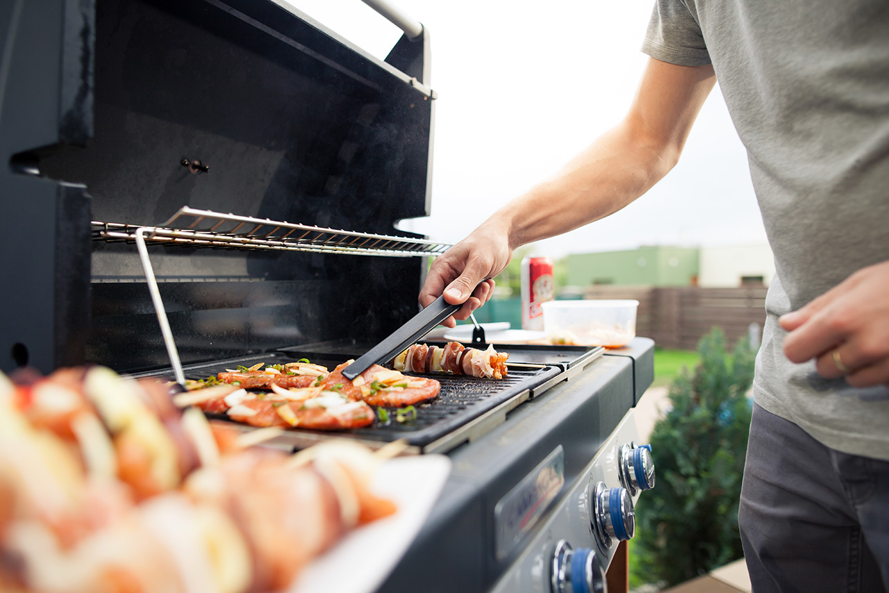 Image of a man grilling
