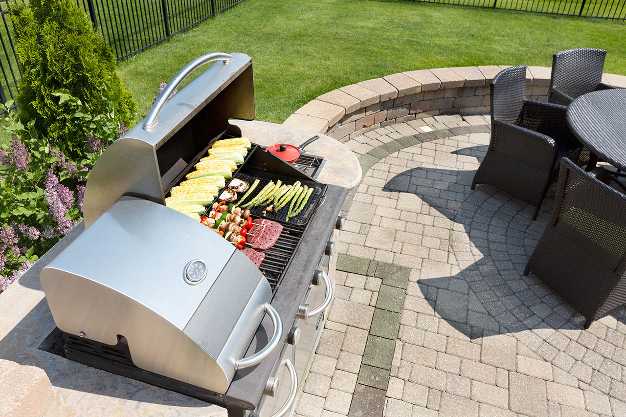 Image of a bbq griller outside with dining set