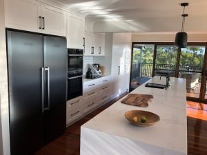 Image of a kitchen layout with full of appliances